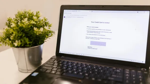 Laptop screen showing a web security notification in a work environment