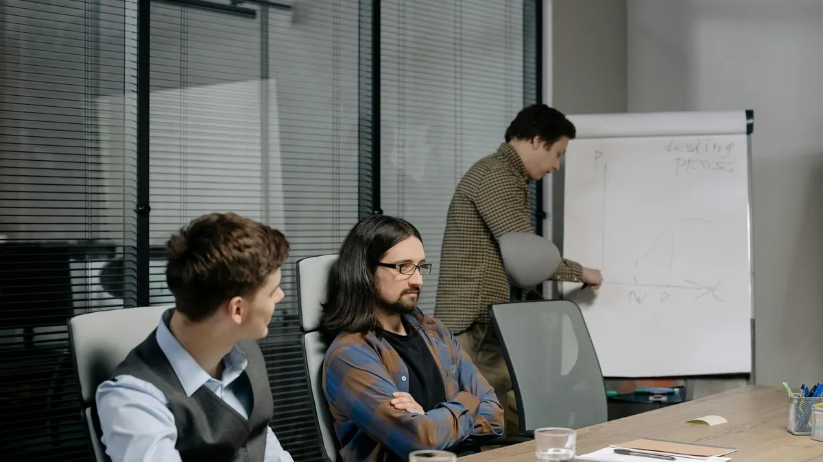 Team of professionals reviewing a web project during an office meeting